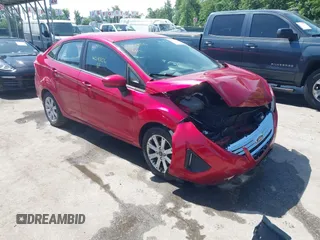 2012 Ford Fiesta SE z VIN 3FADP4BJ9CM220870, wystawiony jako IAAI lot #42245806 z przebiegiem 109 258 mil mil oraz . Historia ofert i sprzedaży dostępna na DreamBid. Obrazek 1.