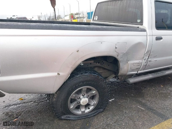 2004 Nissan Frontier 2WD XE with VIN 1N6ED29X04C423328, listed as a IAAI auction lot 41514717 with 297,128 mi miles. Bid and sale history available at carsss.com. Image 6.