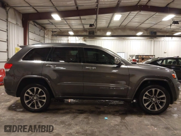 2017 Jeep Grand Cherokee Overland z VIN 1C4RJFCG6HC641812, wystawiony jako IAAI lot #42053404 z przebiegiem 129 184 mil mil oraz . Historia ofert i sprzedaży dostępna na DreamBid. Obrazek 13.