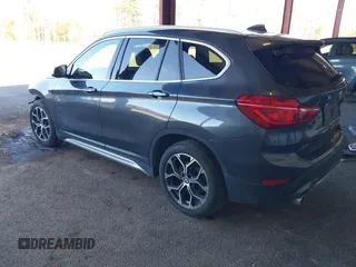 2021 BMW X1 xDrive28i with VIN WBXJG9C02M5T41170, listed as a IAAI auction lot 41886408 with 56,316 mi miles. Bid and sale history available at carsss.com. Image 3.
