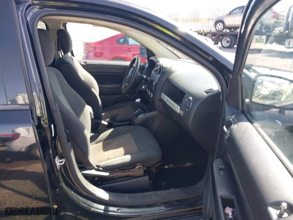 2014 Jeep Compass Sport with VIN 1C4NJCBB1ED587005, listed as a IAAI auction lot 41706302 with 184,419 mi miles. Bid and sale history available at carsss.com. Image 5.