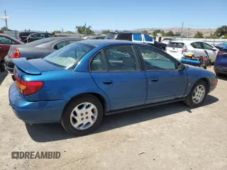2000 Saturn SL with VIN 1G8ZK5271YZ184701, listed as a Copart auction lot 61598135 with 123,309 mi miles and Salvage title. Bid and sale history available at DreamBid. Image 3.