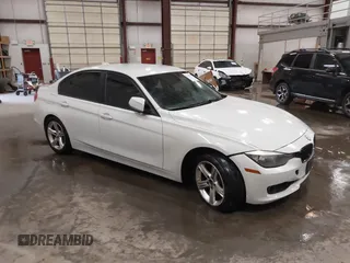 2014 BMW 3 Series 328i with VIN WBA3C1C52EK112194, listed as a IAAI auction lot 41694770 with 139,609 mi miles. Bid and sale history available at carsss.com. Image 1.