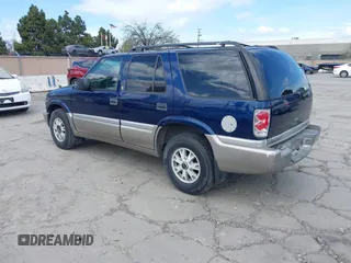 1999 GMC Jimmy SLE with VIN 1GKDT13W8X2526345, listed as a IAAI auction lot 41919975 with 164,214 mi miles. Bid and sale history available at carsss.com. Image 3.