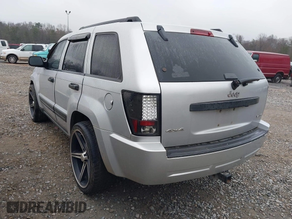 2005 Jeep Grand Cherokee Laredo z VIN 1J4GR48K05C506865, wystawiony jako IAAI lot #41539102 z przebiegiem 237 208 mil mil oraz . Historia ofert i sprzedaży dostępna na DreamBid. Obrazek 3.