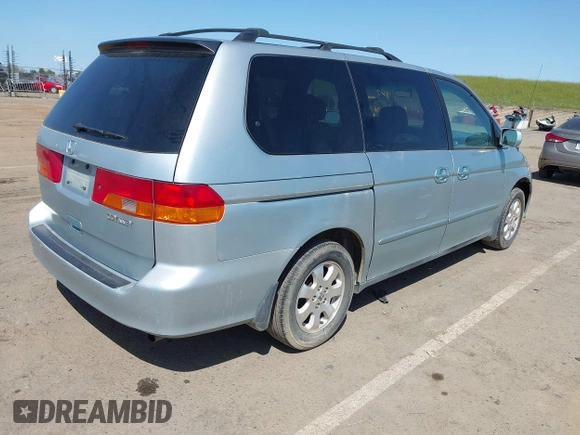 2003 Honda Odyssey EX with VIN 2HKRL18603H502236, listed as a IAAI auction lot 41929501 with 287,538 mi miles and . Bid and sale history available at DreamBid. Image 4.