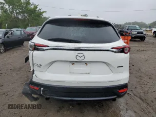 2021 Mazda CX-9 Touring with VIN JM3TCBCY1M0517709, listed as a Copart auction lot 57624945 with 64,081 mi miles and Salvage title. Bid and sale history available at DreamBid. Image 6.