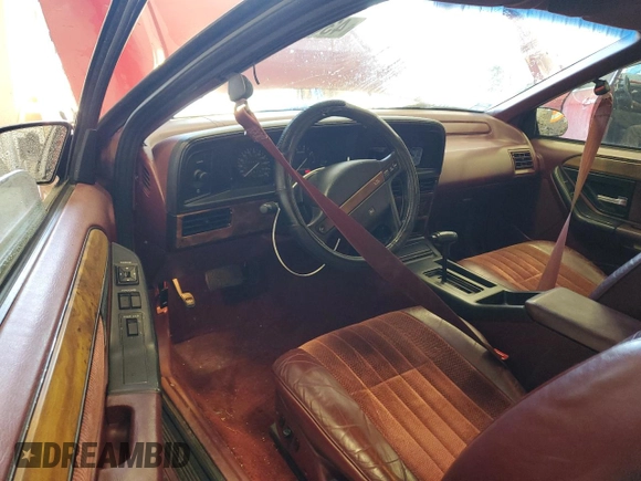 1991 Mercury Cougar z VIN 1MEPM60T4MH652996, wystawiony jako Copart lot #43811635 z przebiegiem 129 452 mil mil oraz Nie do naprawy • Non repairable. Historia ofert i sprzedaży dostępna na DreamBid. Obrazek 8.