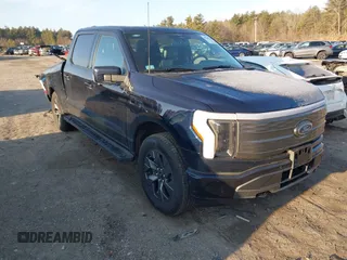 2023 Ford F-150 Lightning Pro with VIN 1FT6W1EV7PWG33511, listed as a IAAI auction lot 41761149 with 10,501 mi miles and . Bid and sale history available at DreamBid. Image 1.