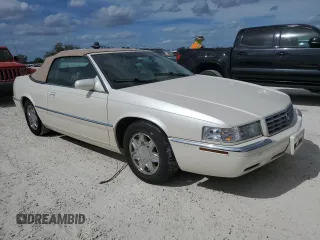 2002 Cadillac Eldorado z VIN 1G6EL12Y32B102263, wystawiony jako Copart lot #77108634 z przebiegiem 43 162 mil mil oraz Nie do naprawy • Non repairable. Historia ofert i sprzedaży dostępna na DreamBid. Obrazek 4.