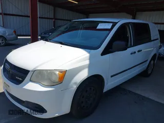 2014 Ram Cargo Van Tradesman with VIN 2C4JRGAG8ER389868, listed as a IAAI auction lot 42126547 with 208,859 mi miles. Bid and sale history available at carsss.com. Image 2.
