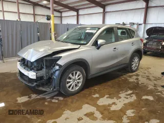 2015 Mazda CX-5 Sport with VIN JM3KE2BE7F0474588, listed as a Copart auction lot 62070345 with 113,033 mi miles and Salvage title. Bid and sale history available at DreamBid. Image 1.