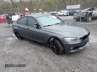2013 BMW 3 Series 328i xDrive with VIN WBA3B3C56DF542509, listed as a IAAI auction lot 42010587 with 187,082 mi miles. Bid and sale history available at carsss.com. Image 1.