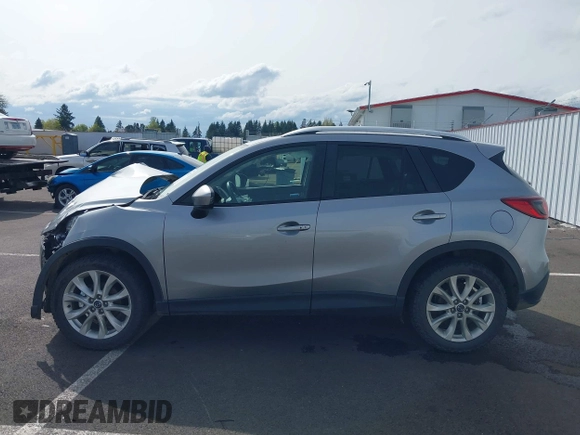 2014 Mazda CX-5 Grand Touring with VIN JM3KE4DY9E0375014, listed as a IAAI auction lot 42000382 with 110,584 mi miles and . Bid and sale history available at DreamBid. Image 15.