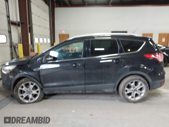 2015 Ford Escape Titanium z VIN 1FMCU0JX9FUB48089, wystawiony jako IAAI lot #41048127 z przebiegiem 133 439 mil mil oraz . Historia ofert i sprzedaży dostępna na DreamBid. Obrazek 14.
