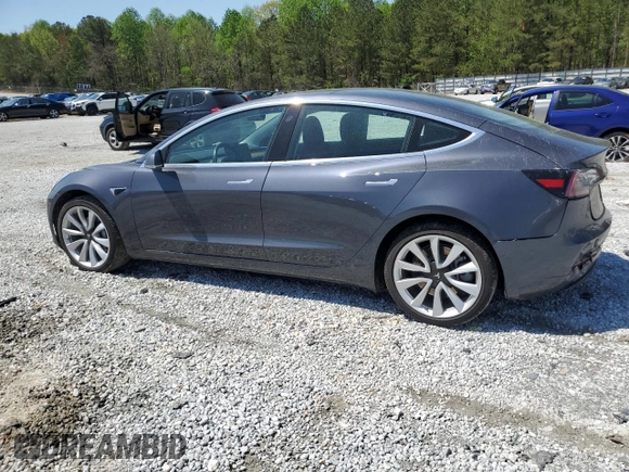 2019 Tesla Model 3 Mid Range z VIN 5YJ3E1EA7KF397524, wystawiony jako Copart lot #52696585 z przebiegiem 82 995 mil mil oraz Szkoda całkowita • Salvage title. Historia ofert i sprzedaży dostępna na DreamBid. Obrazek 2.