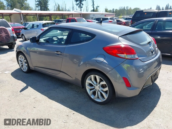 2012 Hyundai Veloster w/Black Int with VIN KMHTC6AD5CU030788, listed as a IAAI auction lot 42774337 with 104,297 mi miles and . Bid and sale history available at DreamBid. Image 3.