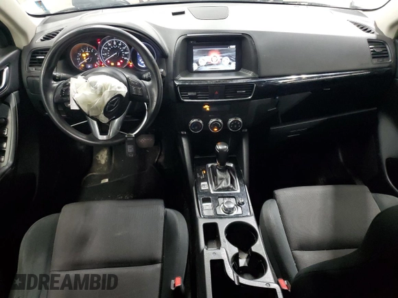 2016 Mazda CX-5 Sport with VIN JM3KE4BY9G0694709, listed as a Copart auction lot 55147555 with 98,900 mi miles and Salvage title. Bid and sale history available at DreamBid. Image 8.