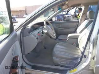 2001 Toyota Avalon XL z VIN 4T1BF28B51U189775, wystawiony jako IAAI lot #41970356 z przebiegiem 247 969 mil mil oraz . Historia ofert i sprzedaży dostępna na DreamBid. Obrazek 5.