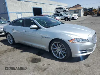 2015 Jaguar XJ with VIN SAJWJ1CD4F8V82496, listed as a Copart auction lot 71013474 with 52,744 mi miles and Salvage title. Bid and sale history available at DreamBid. Image 4.