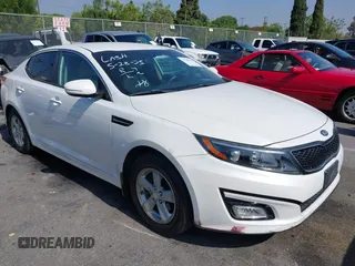 2015 Kia Optima LX z VIN KNAGM4A72F5534910, wystawiony jako IAAI lot #42390385 z przebiegiem 76 430 mil mil oraz . Historia ofert i sprzedaży dostępna na DreamBid. Obrazek 1.