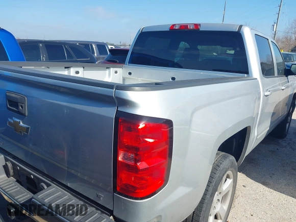 2015 Chevrolet Silverado 1500 LT with VIN 3GCPCREH0FG152809, listed as a IAAI auction lot 41573835 with 213,410 mi miles and . Bid and sale history available at DreamBid. Image 4.