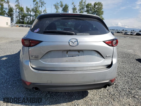 2018 Mazda CX-5 Grand Touring с VIN JM3KFBDM5J0323923, выставлен на аукционе Copart как лот 58162435 с пробегом 144 792 миль миль и Списание • Salvage title. История ставок и продаж доступна на DreamBid. Изображение 6.