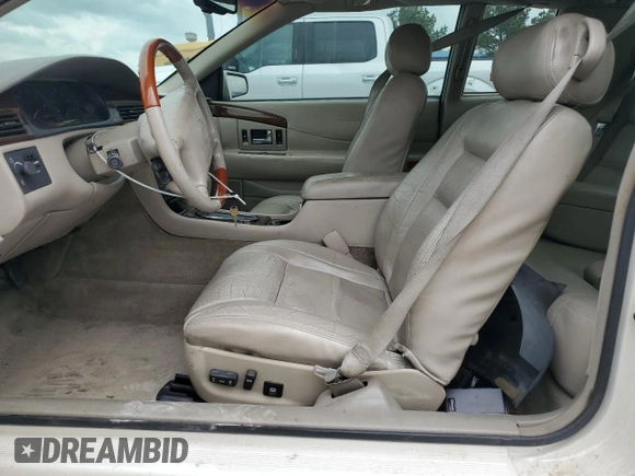 2000 Cadillac Eldorado Touring with VIN 1G6ET1298YB702875, listed as a Copart auction lot 54434255 with 135,282 mi miles and Salvage Title. Bid and sale history available at DreamBid. Image 7.