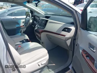 2014 Toyota Sienna XLE with VIN 5TDYK3DC9ES413283, listed as a IAAI auction lot 42091379 with 184,506 mi miles and . Bid and sale history available at DreamBid. Image 5.