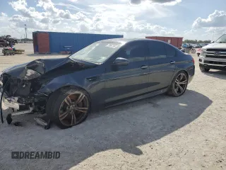 2014 BMW M5 with VIN WBSFV9C54ED097865, listed as a Copart auction lot 79897384 with 0 mi miles and Salvage Title. Bid and sale history available at carsss.com. Image 1.