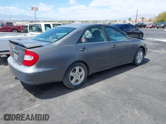 2003 Toyota Camry LE with VIN JTDBE32K130149032, listed as a IAAI auction lot 42063174 with 241,424 mi miles and . Bid and sale history available at DreamBid. Image 4.