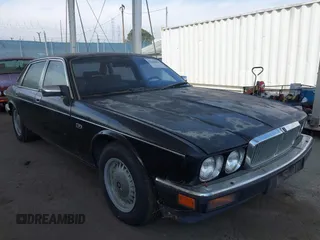 1989 Jaguar XJ with VIN SAJKY1547KC586752, listed as a IAAI auction lot 42268060 with 108,679 mi miles and . Bid and sale history available at DreamBid. Image 1.