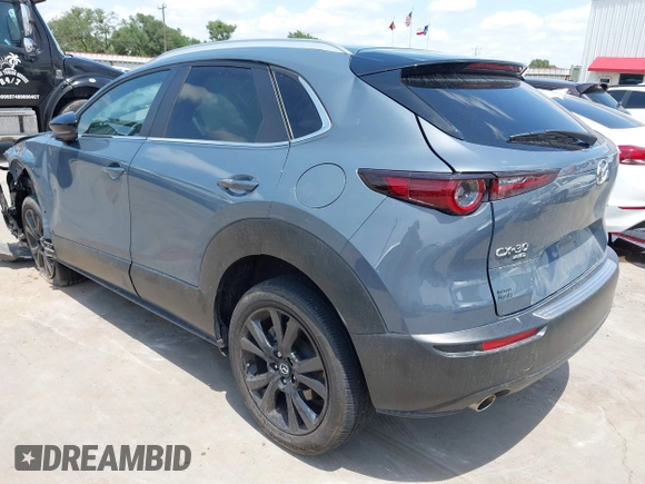 2022 Mazda CX-30 S Carbon Edition with VIN 3MVDMBCL6NM410330, listed as a IAAI auction lot 42107426 with 30,277 mi miles and . Bid and sale history available at DreamBid. Image 3.