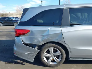 2018 Honda Odyssey EX-L with VIN 5FNRL6H71JB089289, listed as a IAAI auction lot 41813322 with 94,933 mi miles and . Bid and sale history available at DreamBid. Image 6.