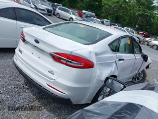 2020 Ford Fusion SE z VIN 3FA6P0LU2LR219671, wystawiony jako IAAI lot #41996821 z przebiegiem Nie podano mil oraz . Historia ofert i sprzedaży dostępna na DreamBid. Obrazek 4.