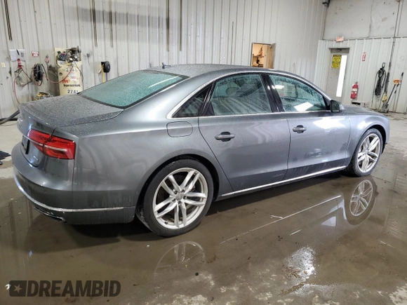 2015 Audi A8 z VIN WAUJGAFDXFN008499, wystawiony jako Copart lot #87658385 z przebiegiem 103 175 mil mil oraz Szkoda całkowita • Salvage title. Historia ofert i sprzedaży dostępna na DreamBid. Obrazek 3.