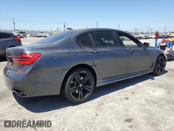 2018 BMW 7 Series 740i with VIN WBA7E2C59JG742809, listed as a Copart auction lot 66995934 with 62,017 mi miles and Salvage Title. Bid and sale history available at carsss.com. Image 3.