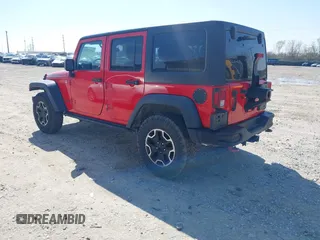 2015 Jeep Wrangler Unlimited Rubicon Hard Rock with VIN 1C4HJWFG9FL525556, listed as a IAAI auction lot 41973576 with 246,949 mi miles and . Bid and sale history available at DreamBid. Image 3.