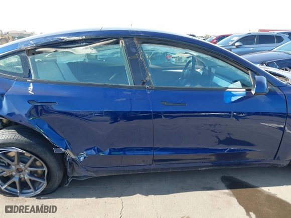 2023 Tesla Model 3 with VIN 5YJ3E1EA9PF697573, listed as a IAAI auction lot 41173833 with 6,966 mi miles. Bid and sale history available at carsss.com. Image 13.