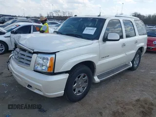 2005 Cadillac Escalade z VIN 1GYEC63T55R115387, wystawiony jako IAAI lot #41791855 z przebiegiem 165 246 mil mil oraz . Historia ofert i sprzedaży dostępna na DreamBid. Obrazek 2.