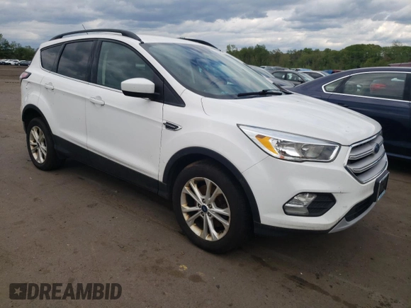 2018 Ford Escape SE z VIN 1FMCU9GDXJUA71940, wystawiony jako Copart lot #55891775 z przebiegiem 117 298 mil mil oraz Tytuł czysty. Historia ofert i sprzedaży dostępna na DreamBid. Obrazek 4.