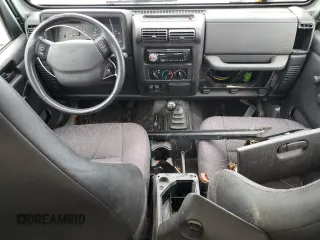 2002 Jeep Wrangler Sport with VIN 1J4FA49S32P733909, listed as a Copart auction lot 72776204 with 157,508 mi miles and Non Repairable. Bid and sale history available at carsss.com. Image 8.