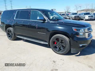 2017 Chevrolet Suburban Premier with VIN 1GNSKJKC8HR285321, listed as a IAAI auction lot 41796659 with 128,113 mi miles and . Bid and sale history available at DreamBid. Image 1.