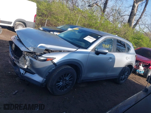 2020 Mazda CX-5 Touring with VIN JM3KFACM5L0766698, listed as a IAAI auction lot 42006157 with 80,288 mi miles and . Bid and sale history available at carsss.com. Image 14.