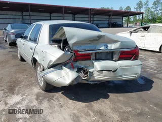 2004 Mercury Grand Marquis LS Premium z VIN 2MEHM75W64X681851, wystawiony jako IAAI lot #42389437 z przebiegiem 118 153 mil mil oraz . Historia ofert i sprzedaży dostępna na DreamBid. Obrazek 6.