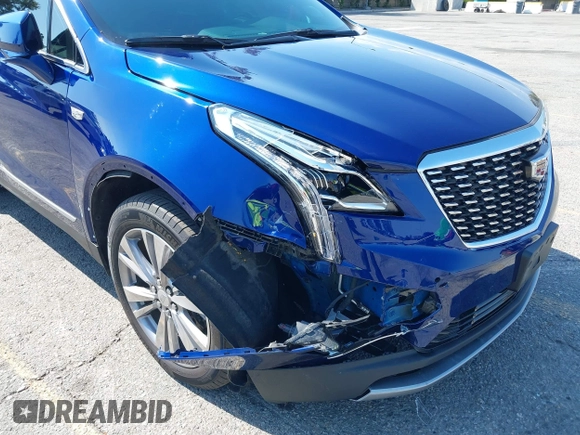 2023 Cadillac XT5 FWD Premium Luxury z VIN 1GYKNCRS3PZ176654, wystawiony jako IAAI lot #42136259 z przebiegiem 20 403 mil mil oraz . Historia ofert i sprzedaży dostępna na DreamBid. Obrazek 6.