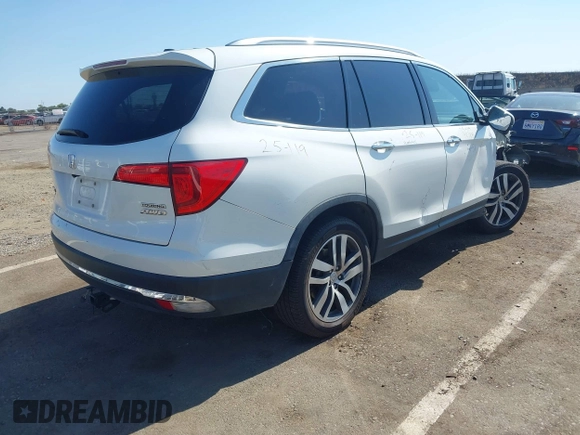 2018 Honda Pilot Touring with VIN 5FNYF6H95JB019122, listed as a IAAI auction lot 42439283 with 128,848 mi miles and . Bid and sale history available at DreamBid. Image 4.