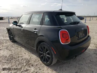 2021 MINI Hardtop 4 Door Oxford Edition with VIN WMWXU7C09M2N79553, listed as a Copart auction lot 84939724 with 59,139 mi miles and Salvage Title. Bid and sale history available at carsss.com. Image 2.