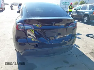 2024 Tesla Model Y Long Range with VIN 7SAYGDEEXRF983040, listed as a IAAI auction lot 41555332 with 79,506 mi miles and . Bid and sale history available at DreamBid. Image 6.