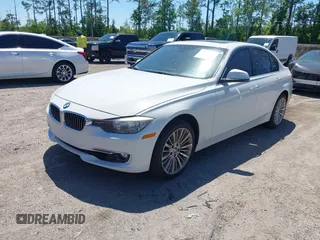 2013 BMW 3 Series 328i xDrive with VIN WBA3B5C51DJ599144, listed as a IAAI auction lot 42059260 with 84,153 mi miles. Bid and sale history available at carsss.com. Image 2.